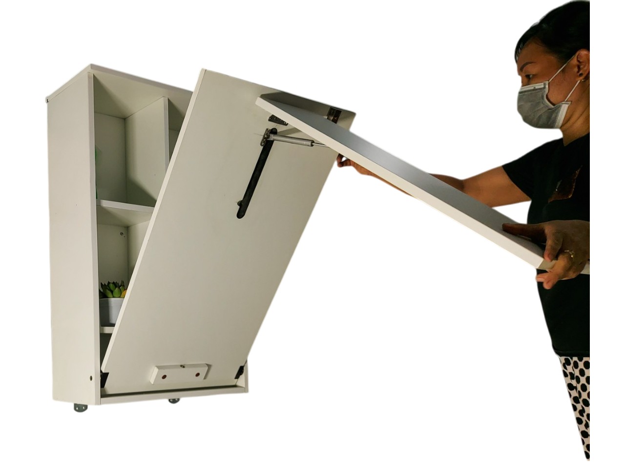  Bàn học/làm việc gấp tường màu trắng được mở ra từ tủ kệ nhỏ.