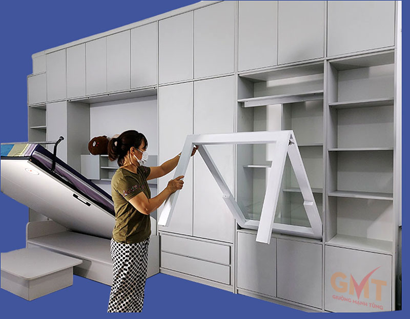 Xưởng sản xuất nội thất thông minh uy tín, giá tốt nhất tại TP.HCM thi công hệ tủ kịch trần tích hợp giường gấp và bàn làm việc đa năng.